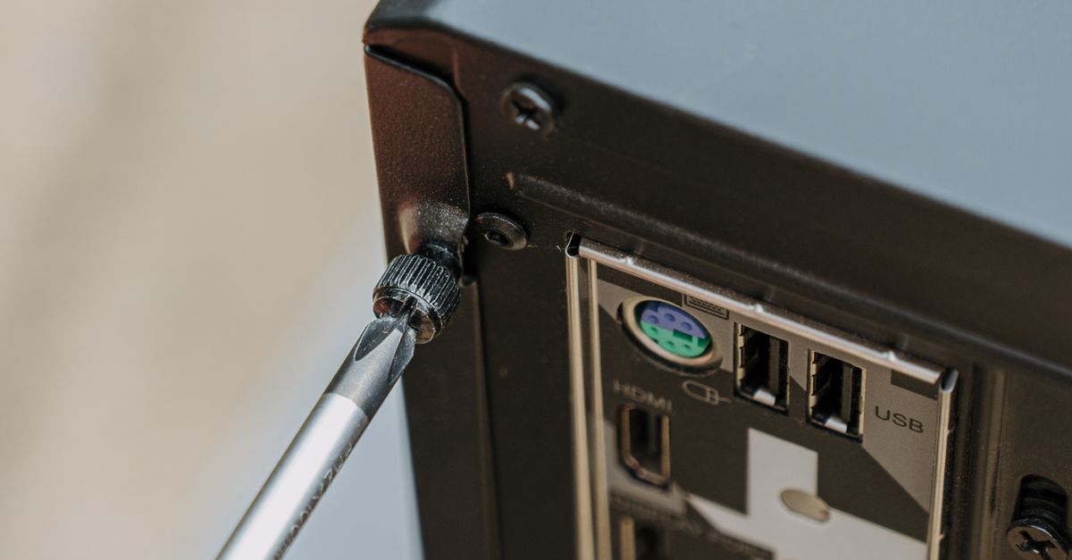 DIY PC Maintenance - Back Panel Unscrewing · Free Stock Photo