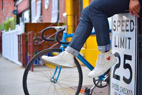 Person Wearing White Sneakers