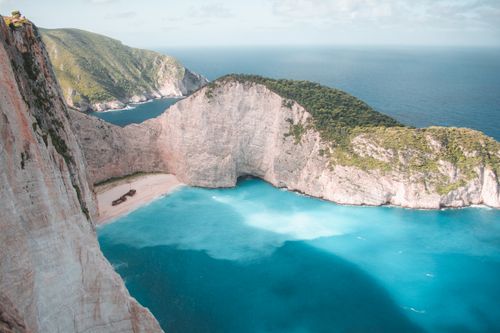 Free Scenic aerial view of Navagio Beach with its iconic shipwreck on Zakinthos Island, Greece. Stock Photo