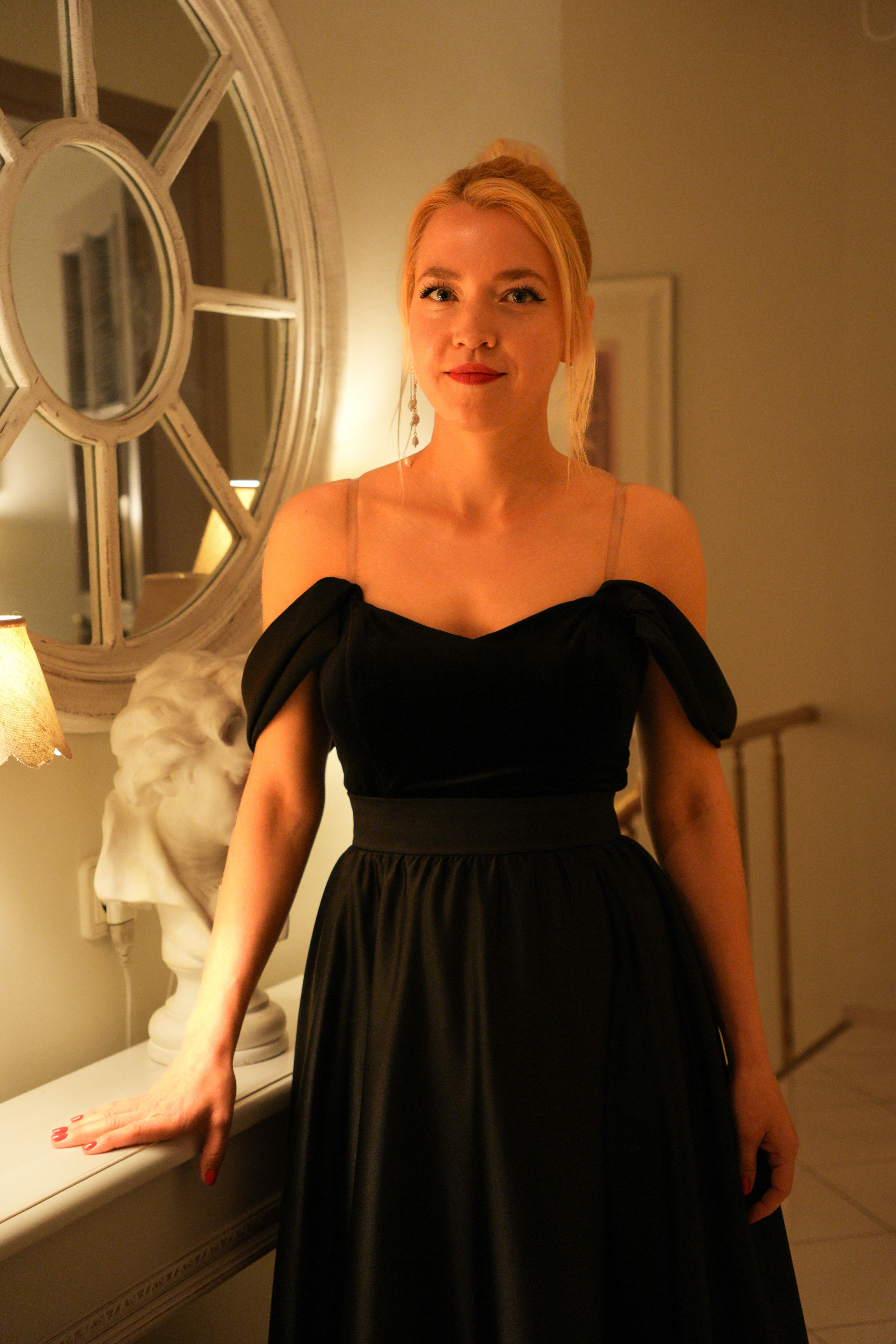 Elegant Woman Posing in Black Dress Indoors · Free Stock Photo