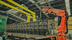 Industrial Crane Loading Container in Warehouse