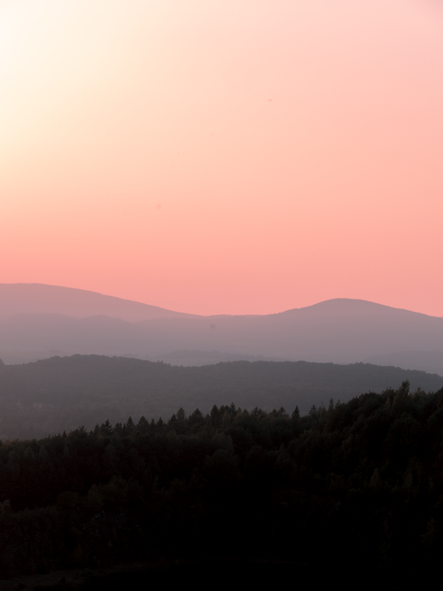 Free Breathtaking view of sunset skies over the rolling hills of Karpacz, Poland. Stock Photo