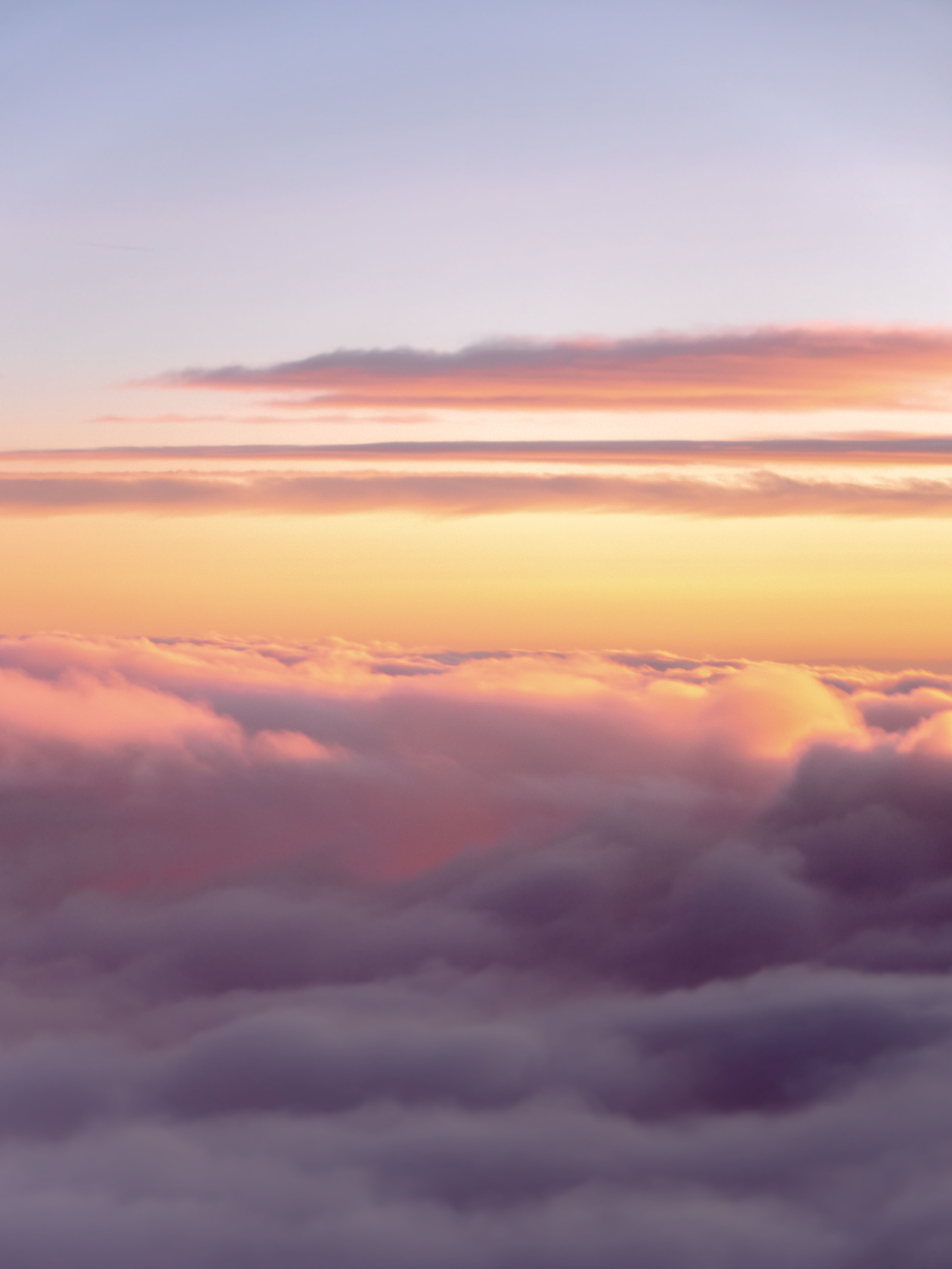 Serene Pink and Purple Sunset Above the Clouds · Free Stock Photo