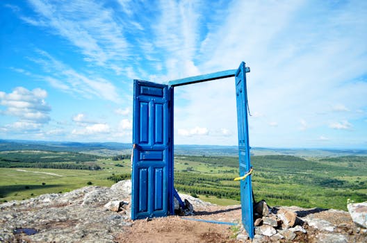 A vibrant blue door frames a scenic landscape in Departamento de Maldonado, Uruguay.
