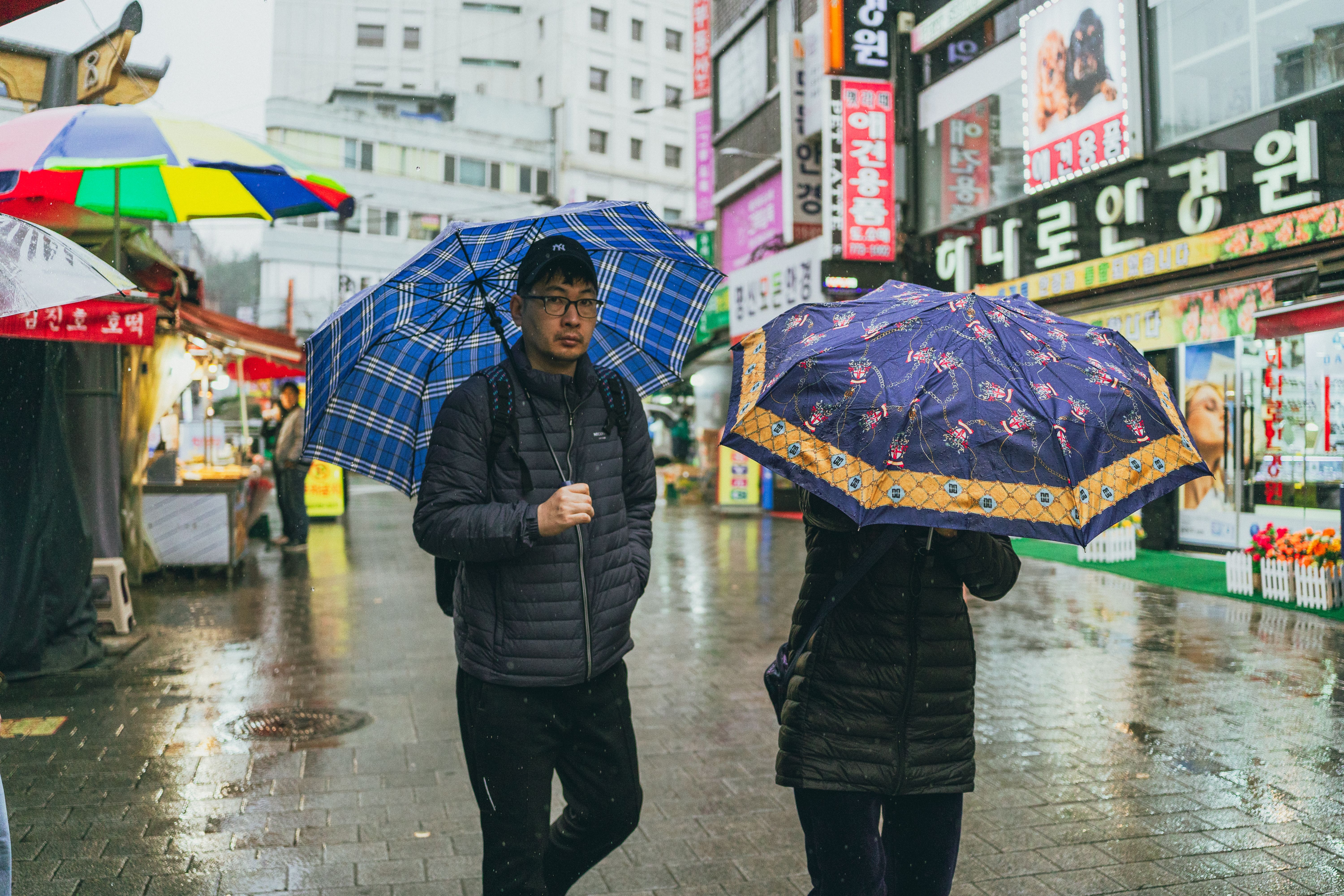 Rainy Day Stroll in Lively Seoul Street Market · Free Stock Photo