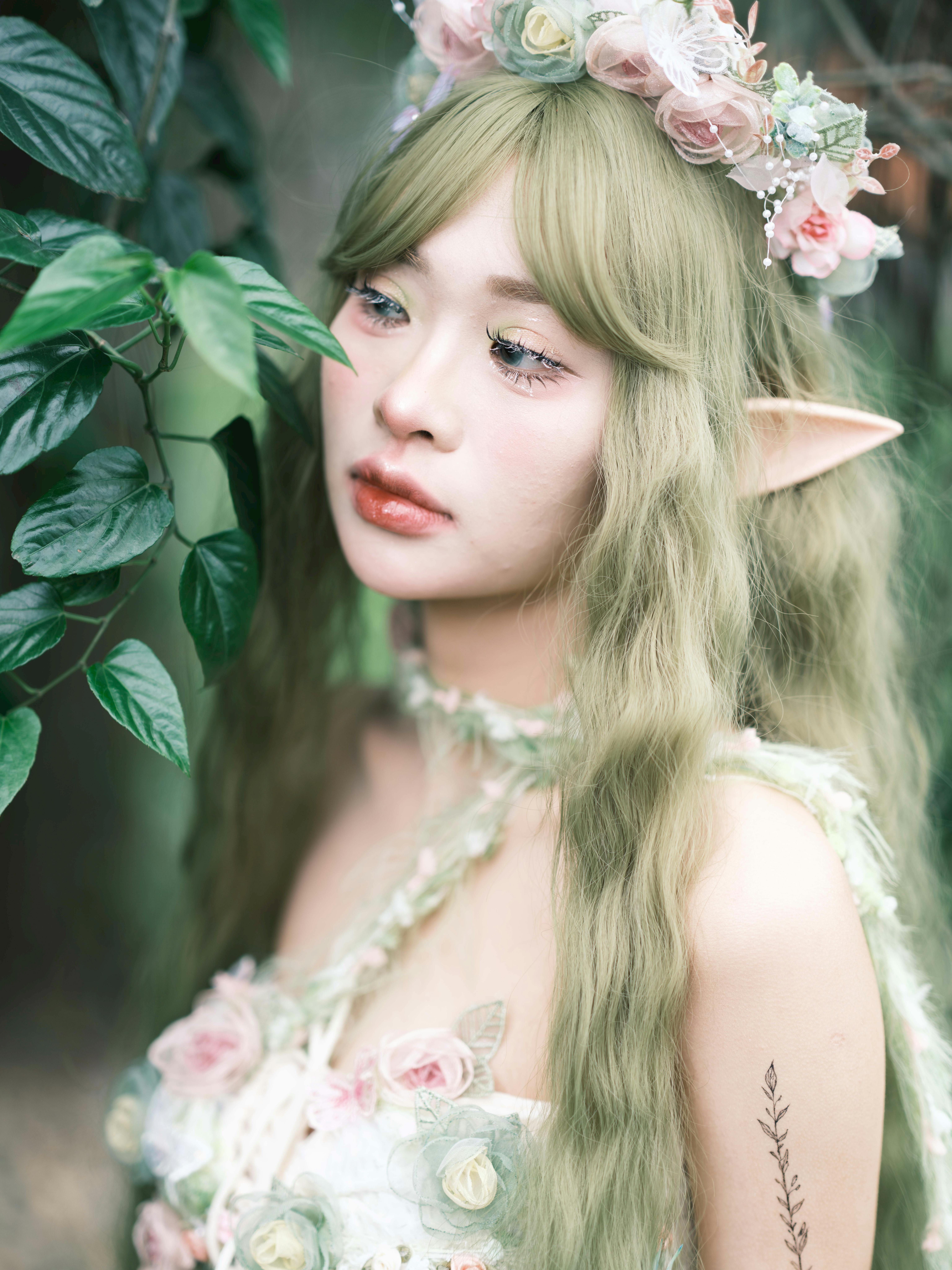 Gardener tending to lush green plants using natural methods