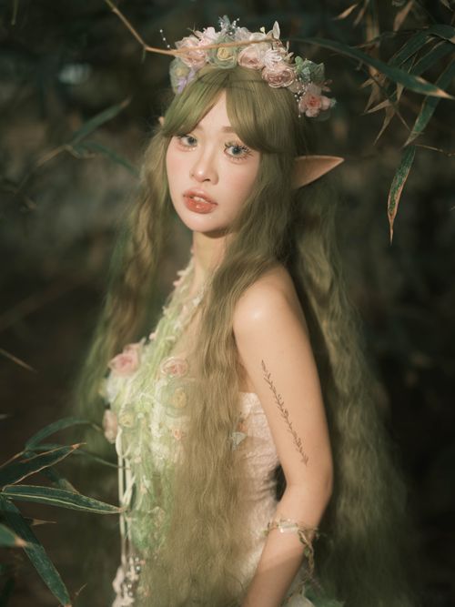 Free A fairy-like woman in a mystical forest, exuding ethereal beauty and magic. Stock Photo