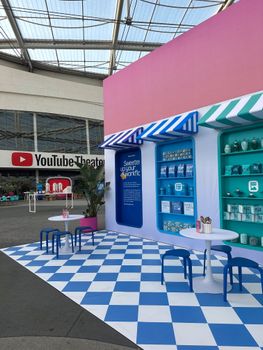 Colorful booth setup at YouTube Theater with vibrant decor and seating.