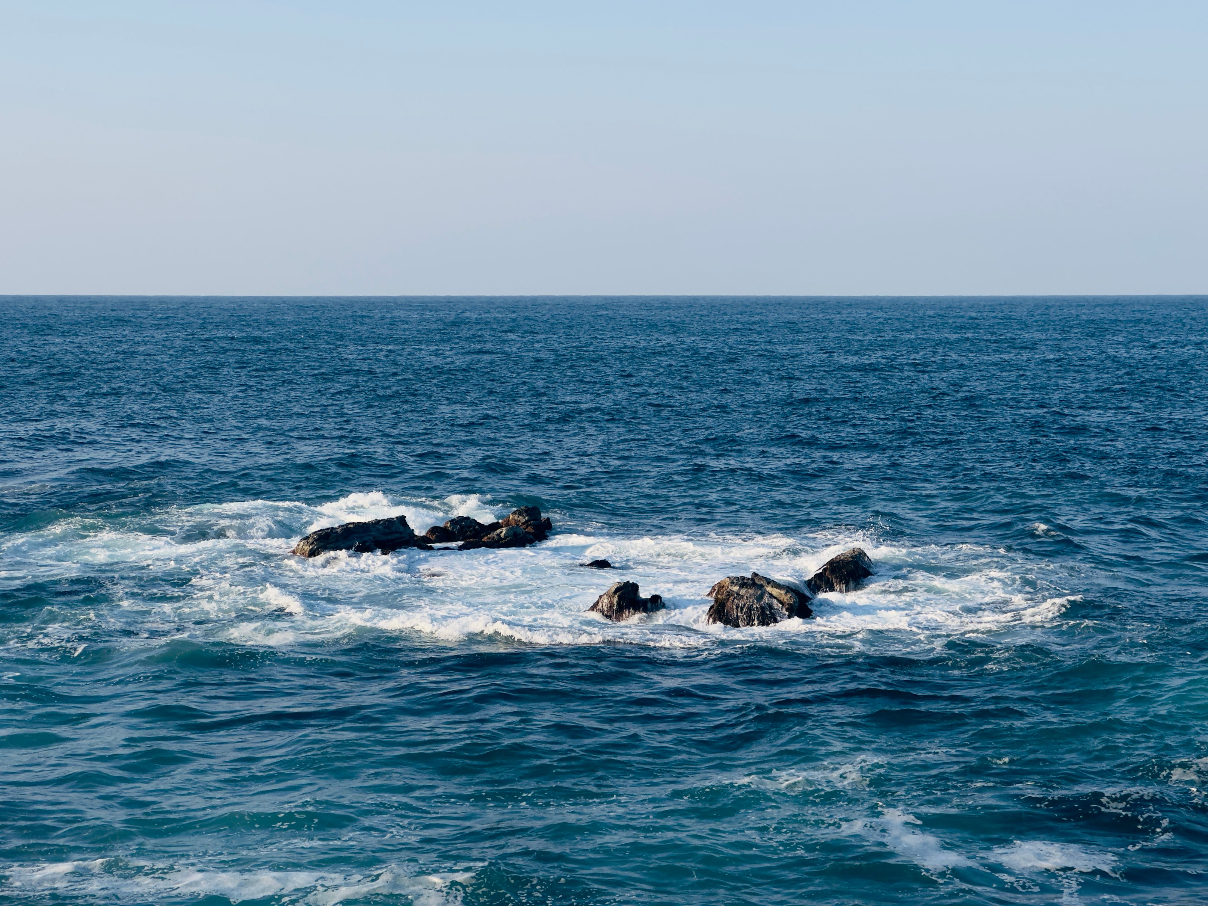 Waves Crashing Against Rocks in the Ocean