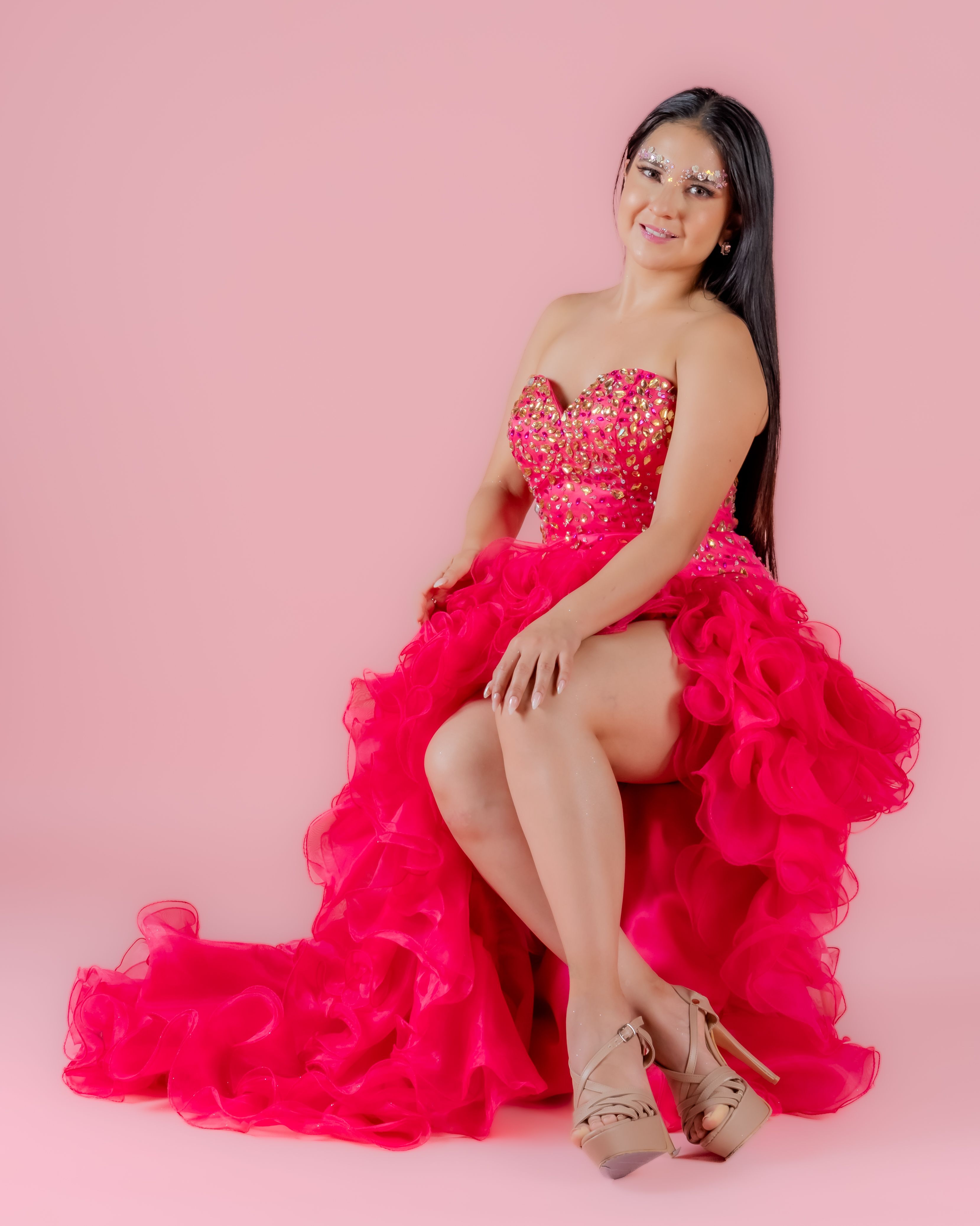 Elegant Woman in Vibrant Red Dress on Pink