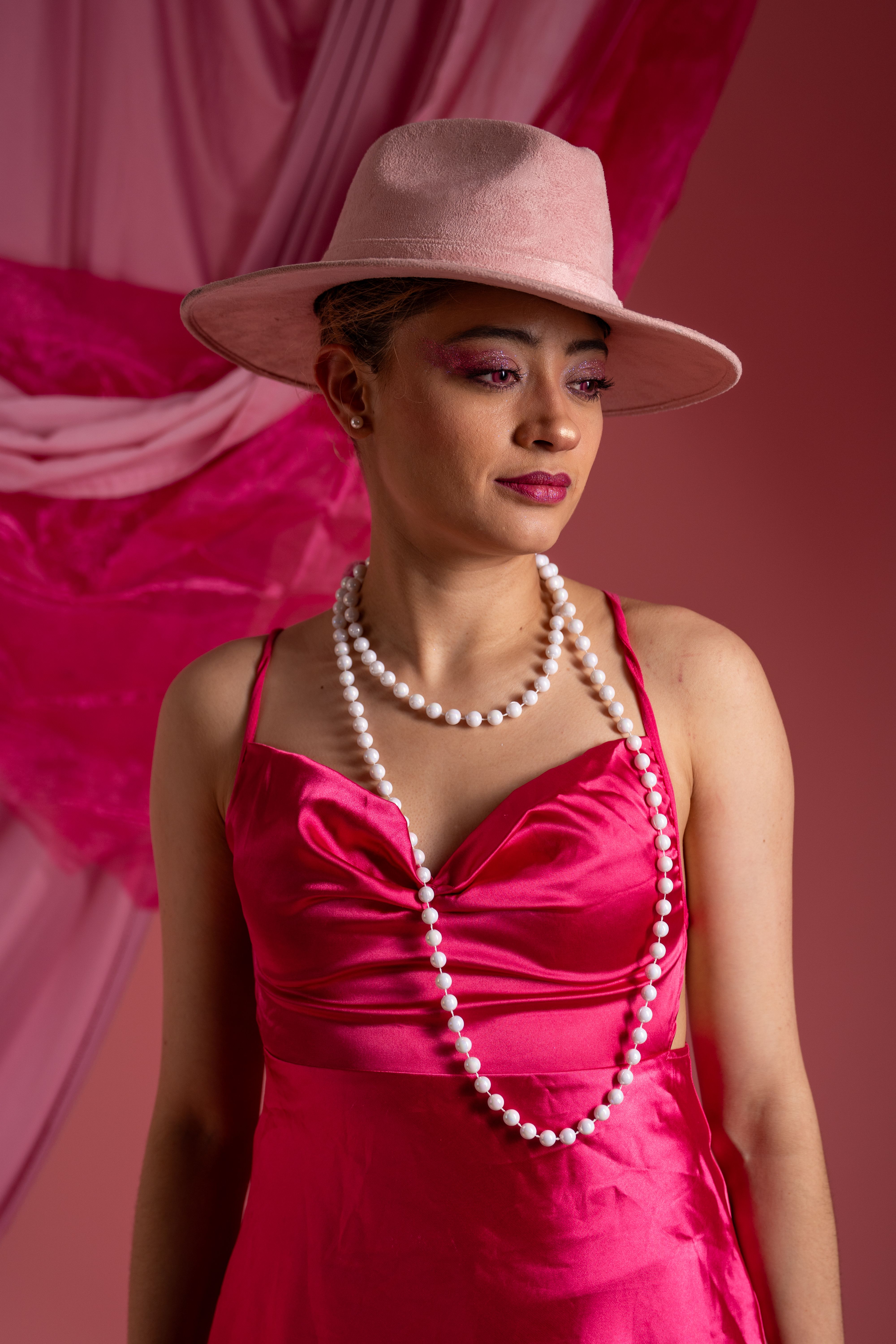 Elegant Woman Posing in Vintage Pink Dress · Free Stock Photo