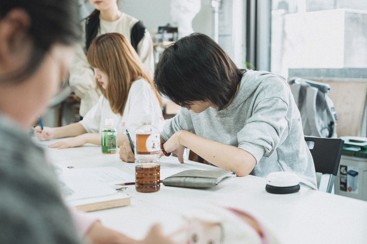 Students engaged in group study in Tokyo classroom fostering collaborative learning
