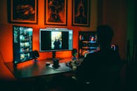 Digital Artist Editing in Neon Lit Workspace