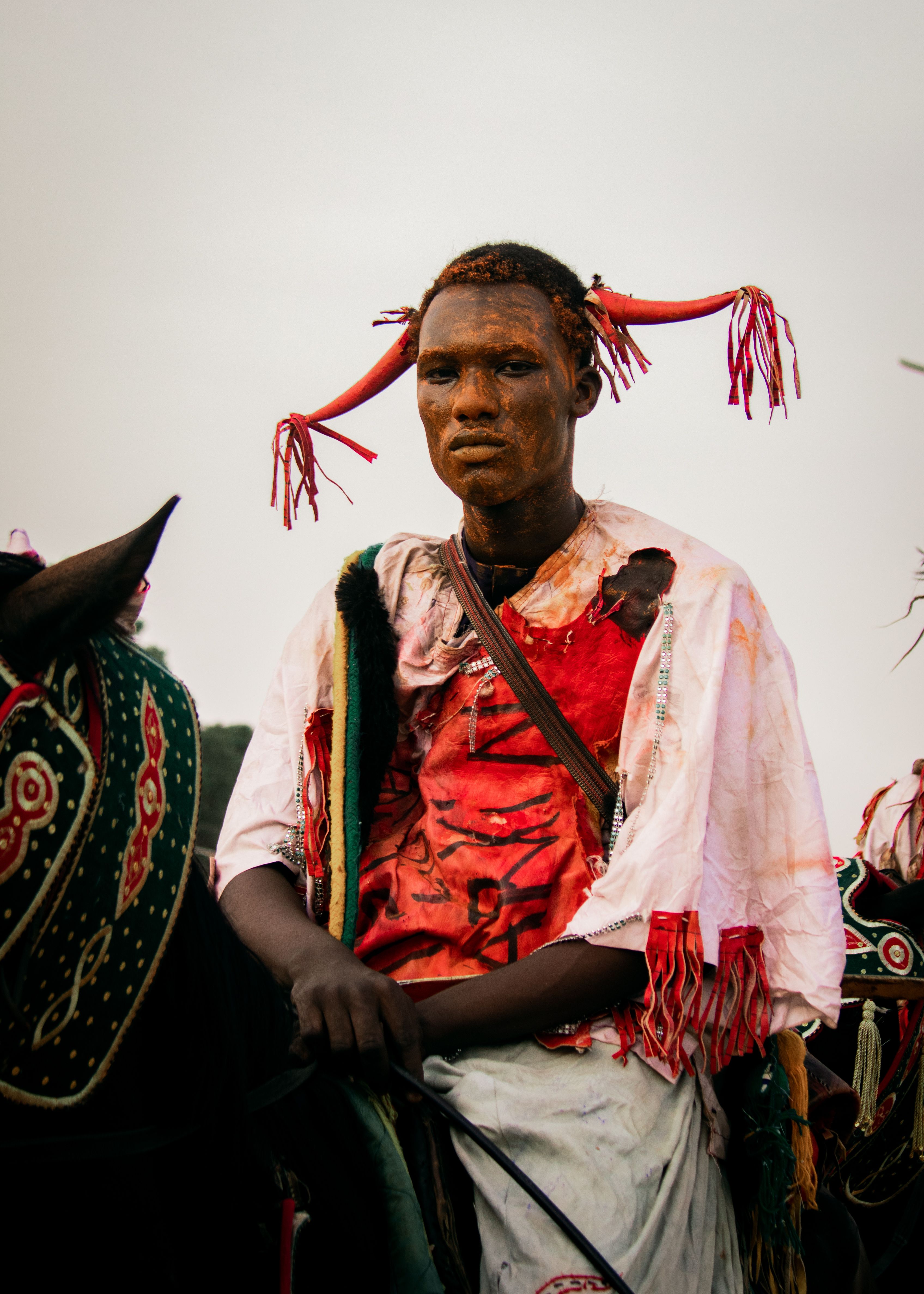 A man in traditional attire participates in a cultural horse riding event in northern Nigeria.