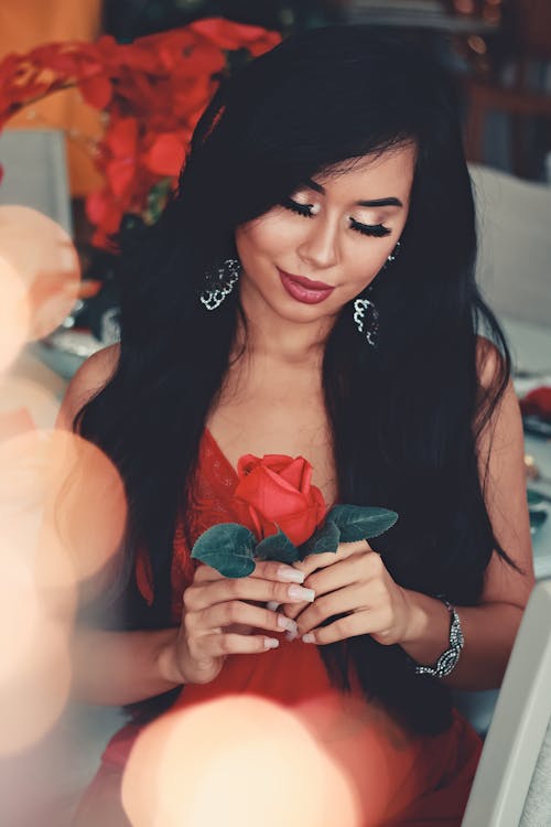 Photo Of Woman Holding Rose