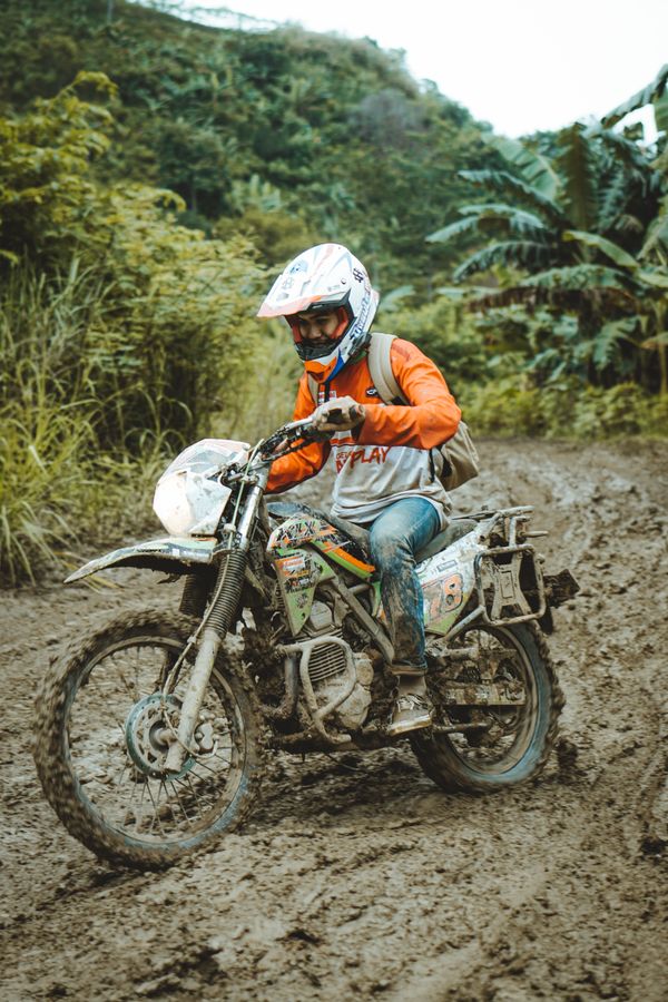 Rider navigating muddy tracks, setengah lima sore on Pexels