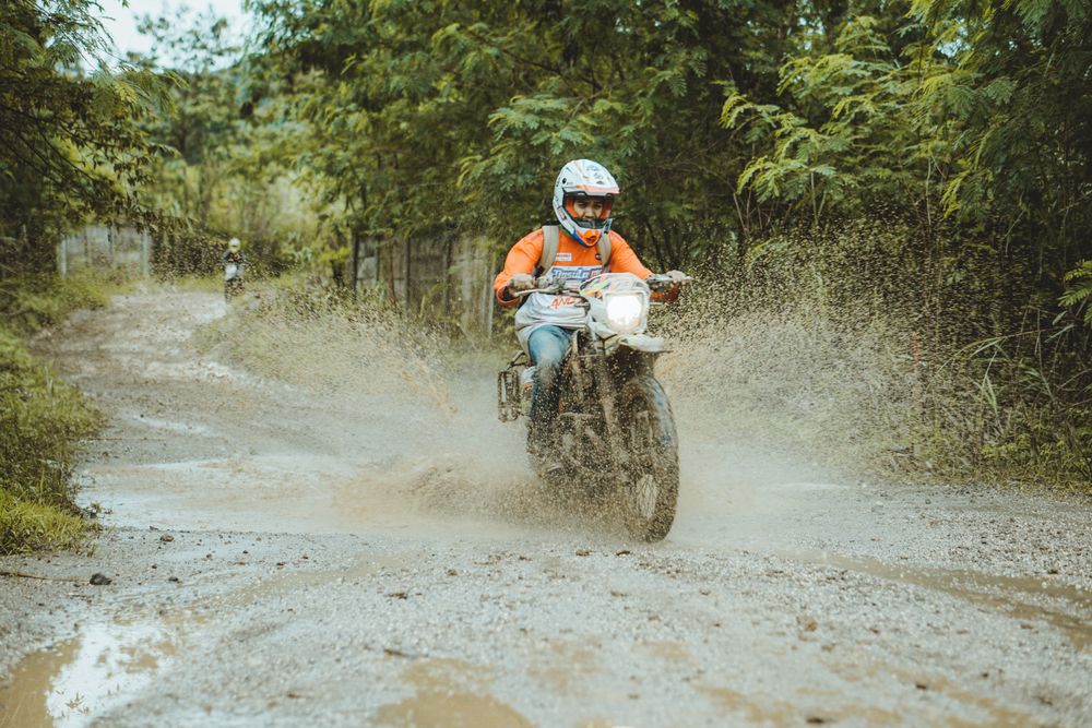 Motocross rider in muddy terrain, setengah lima sore on Pexels