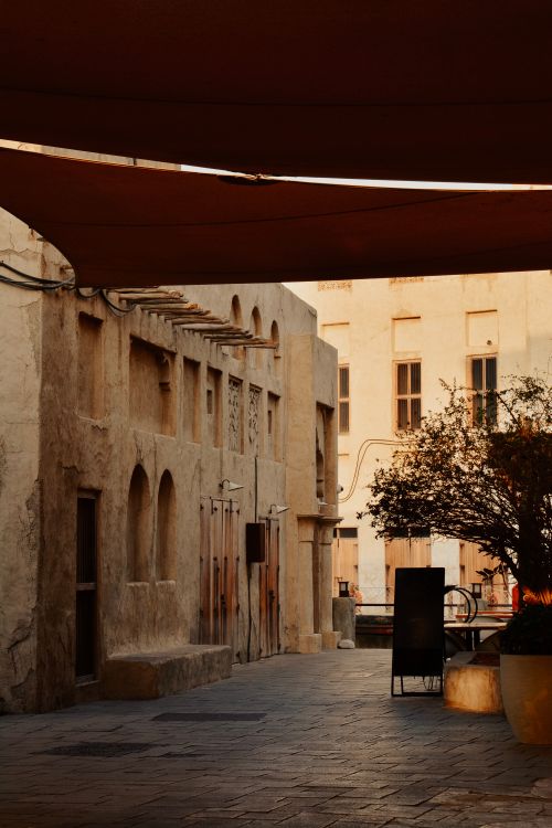 Free A serene view of a historic alley in Al Fahidi, Dubai, capturing traditional architecture at twilight. Stock Photo
