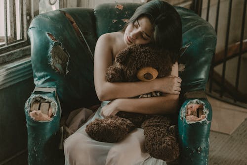 Woman Hugging Brown Bear Plush Toy