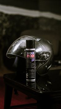 Close-up of a motorbike helmet with Liqui Moly cleaner indoors in Jakarta, Indonesia. - Fotografer Sidoarjo
