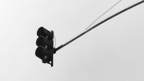 Free Black and white image of a traffic light in Kenitra, Morocco, embodying urban minimalism. Stock Photo