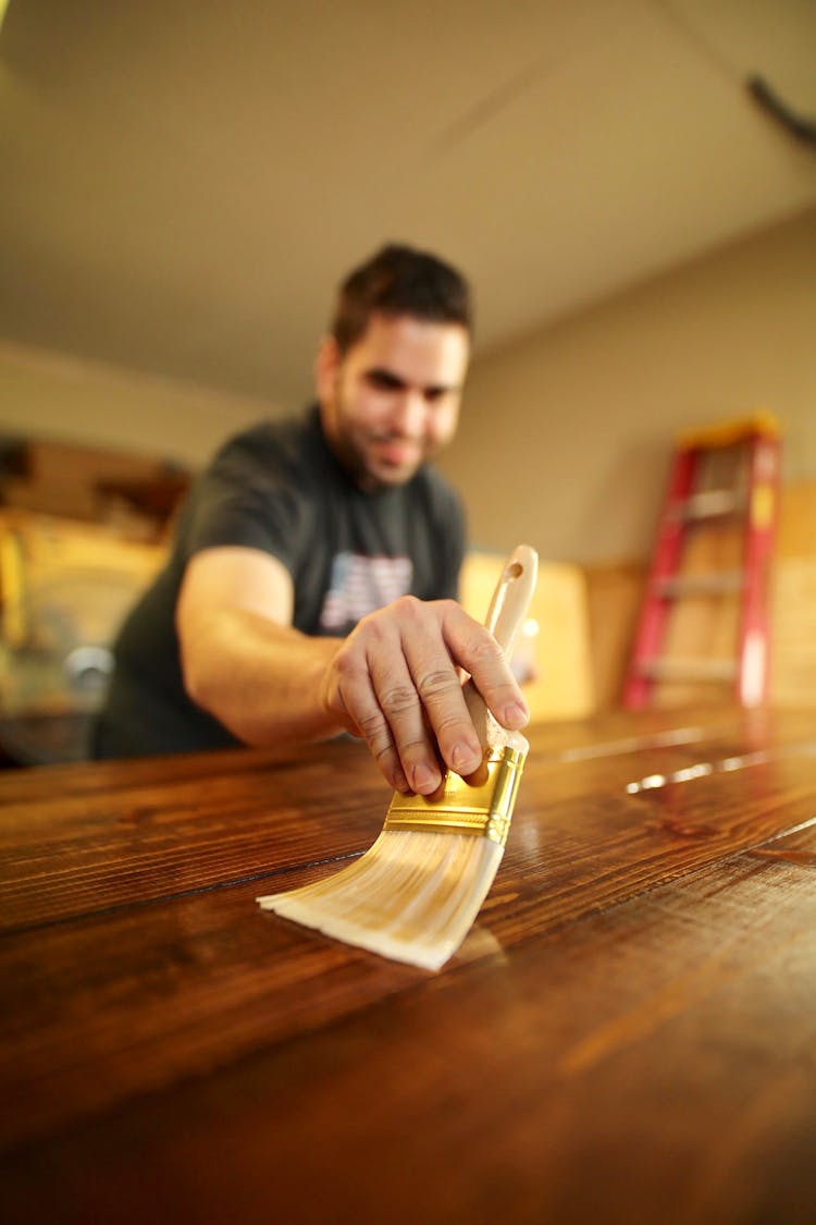 Photo Of Man Applying Varnish