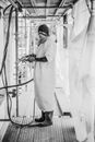 Standing Person Holding Hose