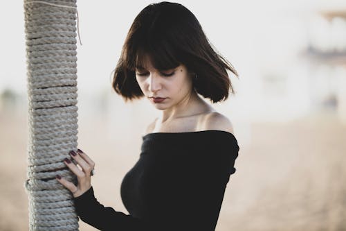 Woman Wearing Black Off-shoulder Top