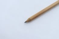 Close-up of a Wooden Pencil on White Paper