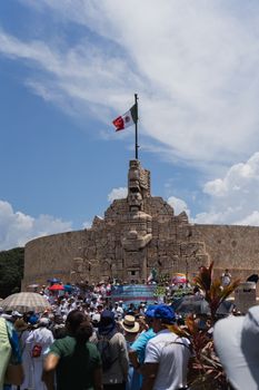 Crowd gathered at the Monumento a la Patria in Mérida, Yucatán, Mexico during a celebration.