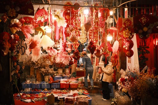 Colorful Asian night market adorned with traditional red decorations and lanterns.