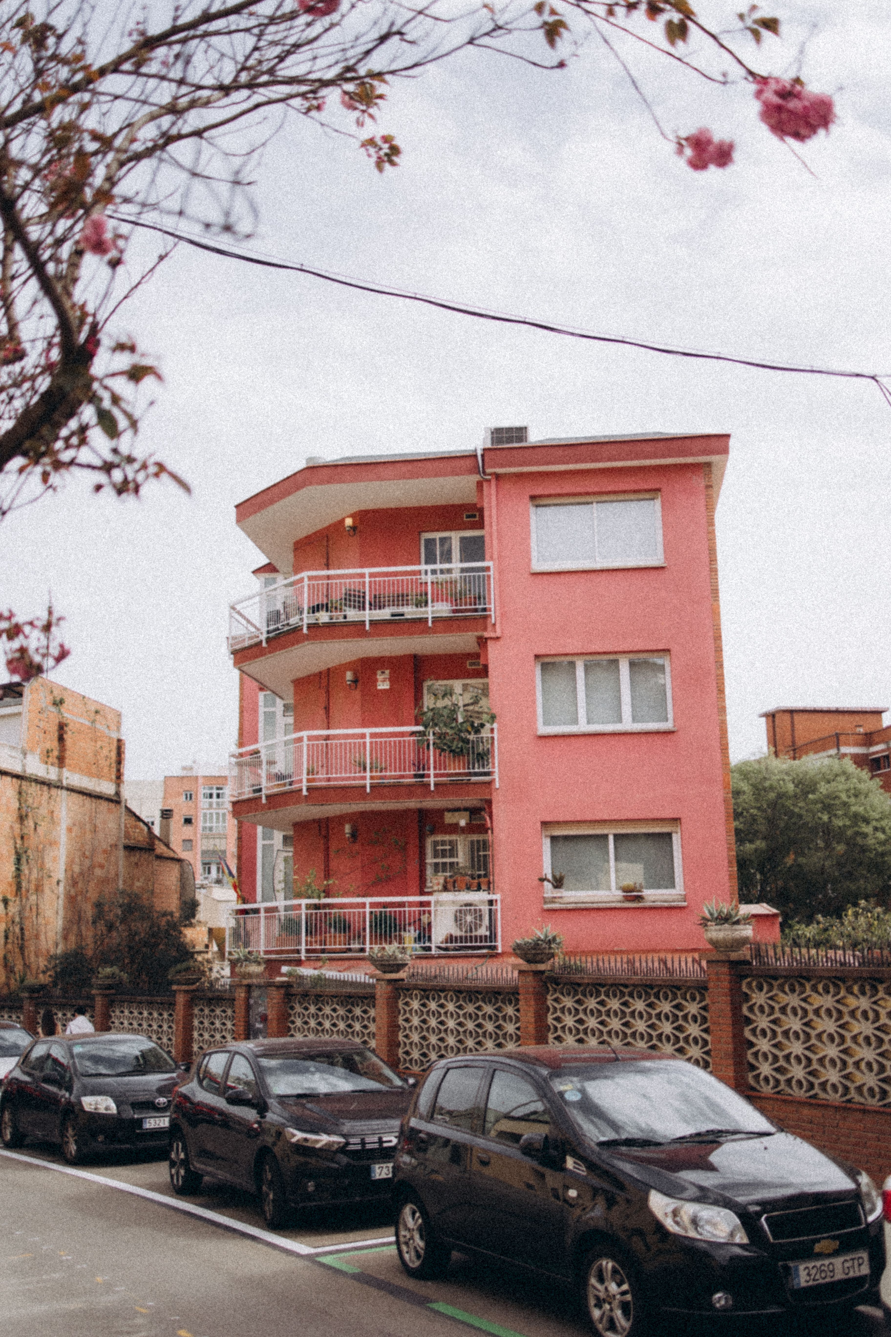 Quaint Pink Apartment Building in Urban Street · Free Stock Photo
