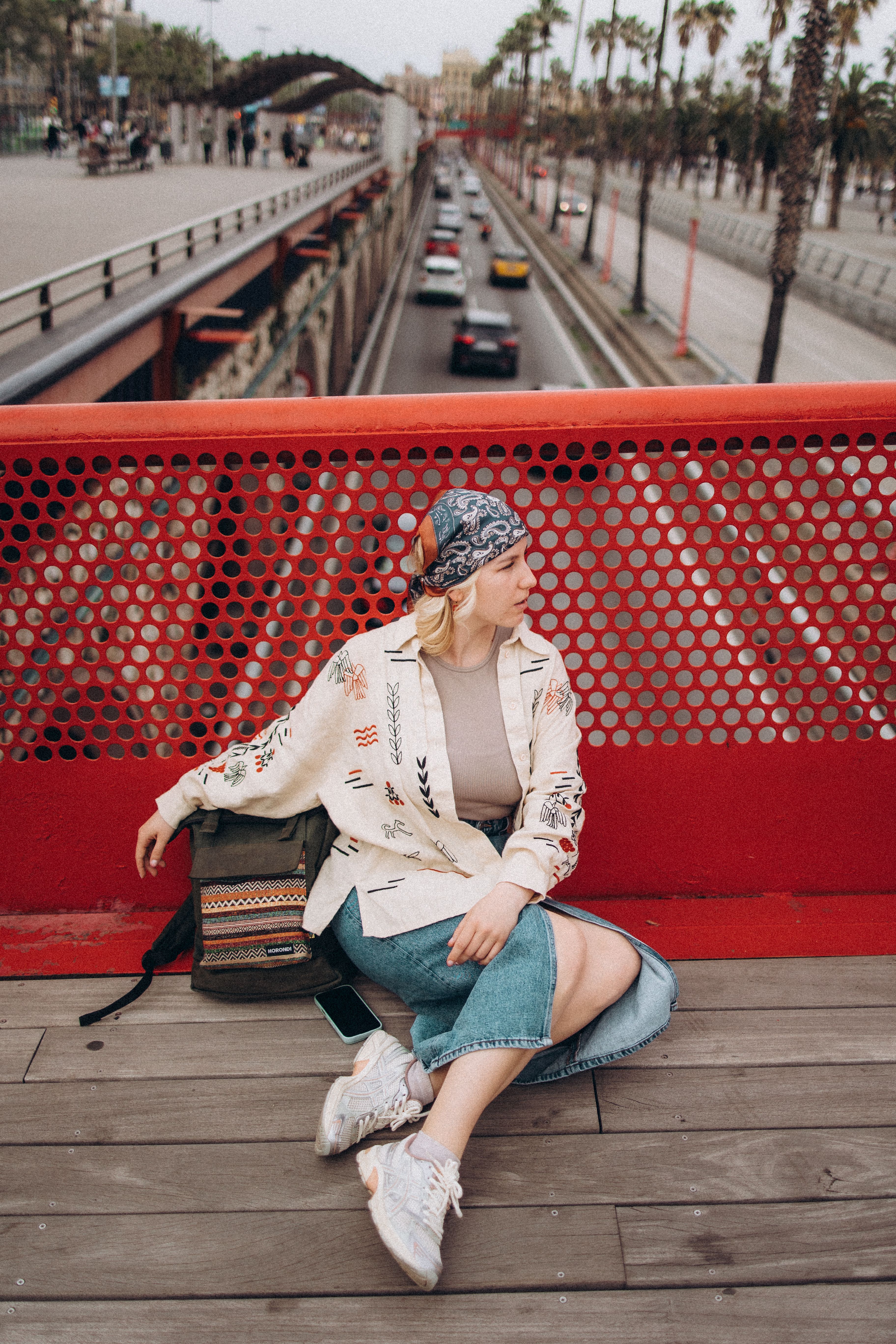 Fashionable Woman Relaxing on Urban Bridge · Free Stock Photo