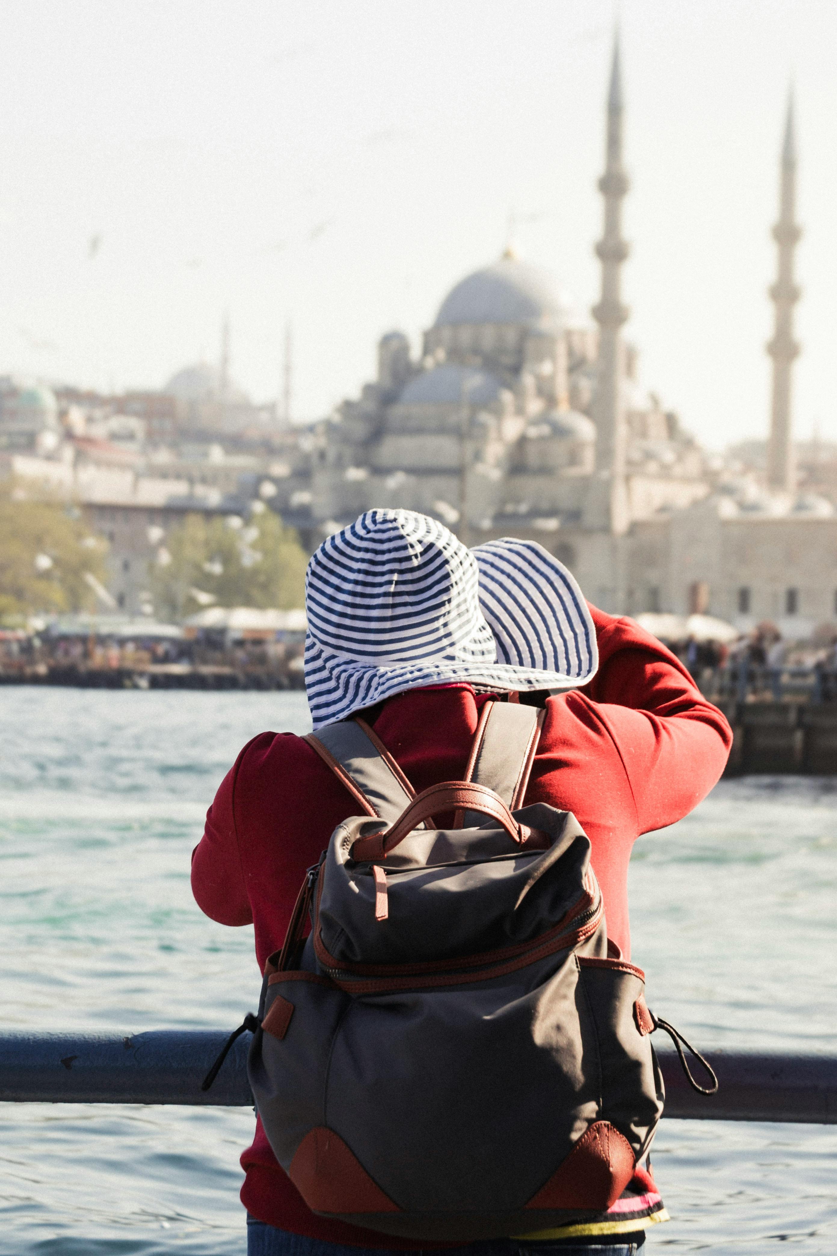 A tourist captures the beauty of an iconic mosque in Istanbul, blending culture with travel.