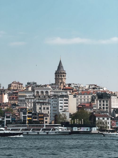Free Scenic view of Galata Tower surrounded by Istanbul's urban landscape and waterfront. Stock Photo