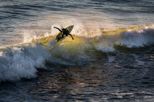 Photo of Person Surfboarding