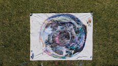 Abstract Canvas Art Displayed Outdoors on Grass