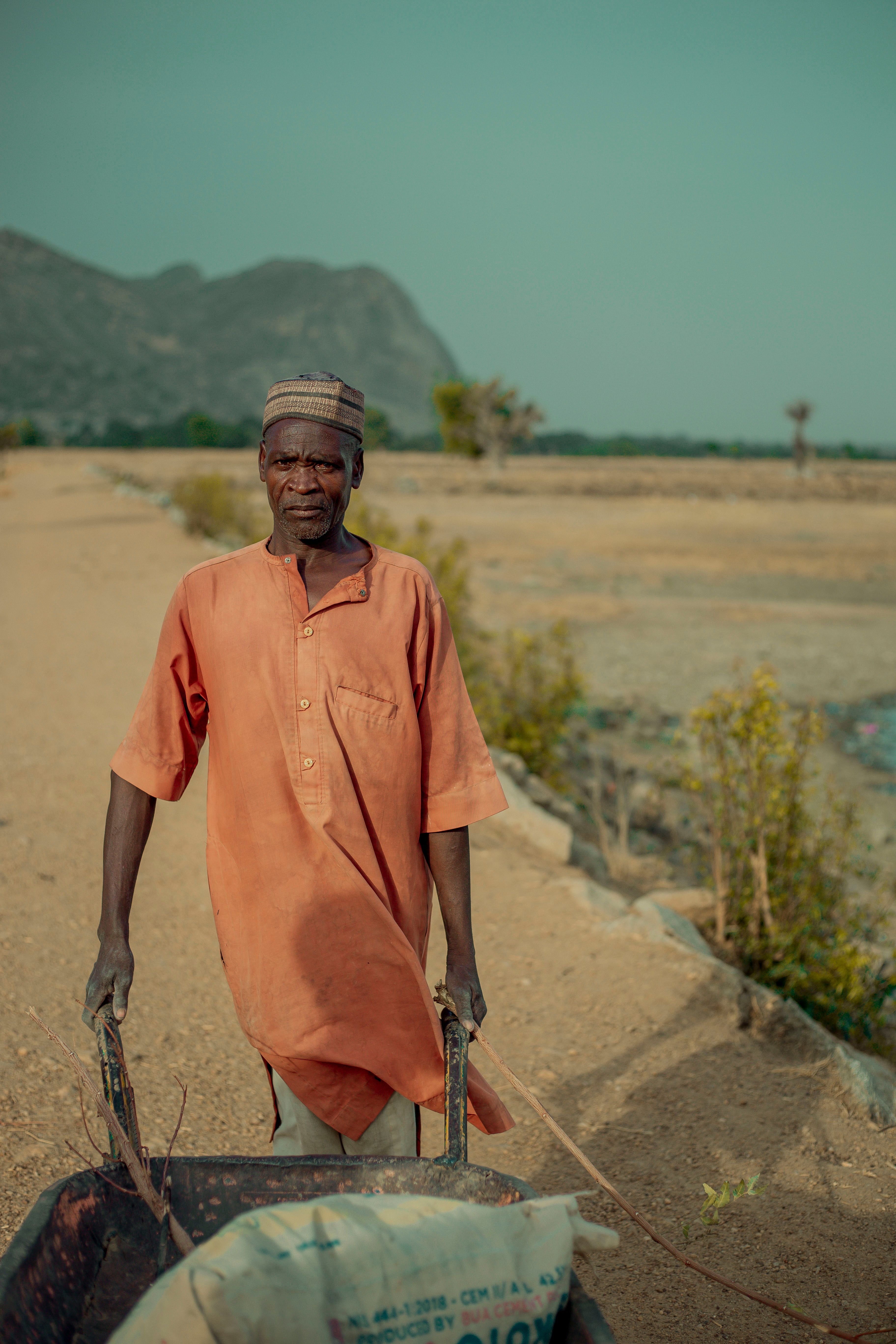 Portrait of Farmer on Rural Dirt Path Outdoors · Free Stock Photo