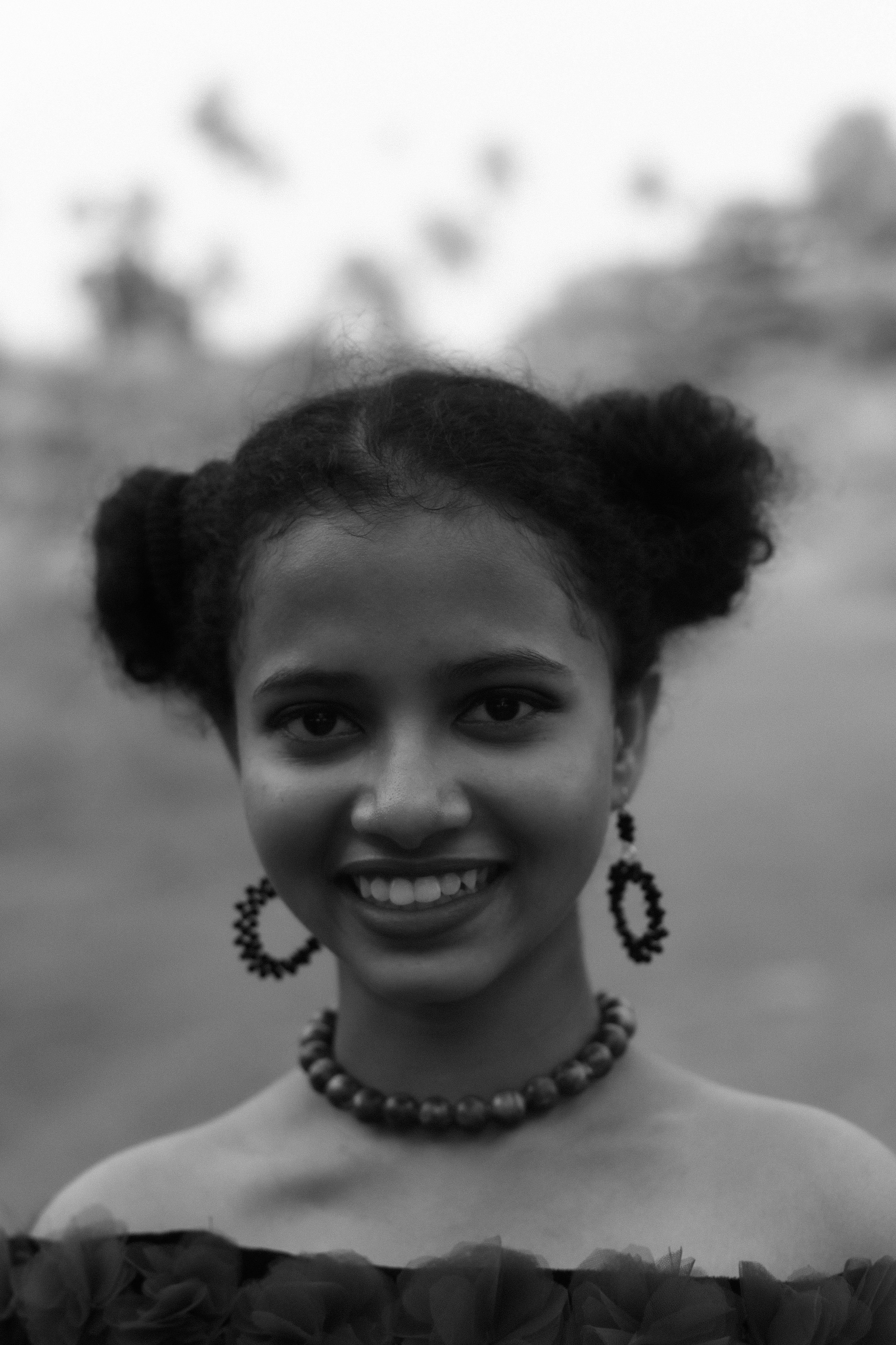 Black and White Portrait of Smiling Young Woman · Free Stock Photo