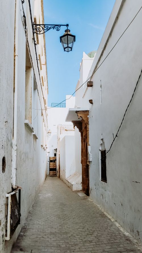 Free Explore the serene beauty of a narrow alleyway in Rabat, Morocco's historic Medina, showcasing traditional architecture. Stock Photo