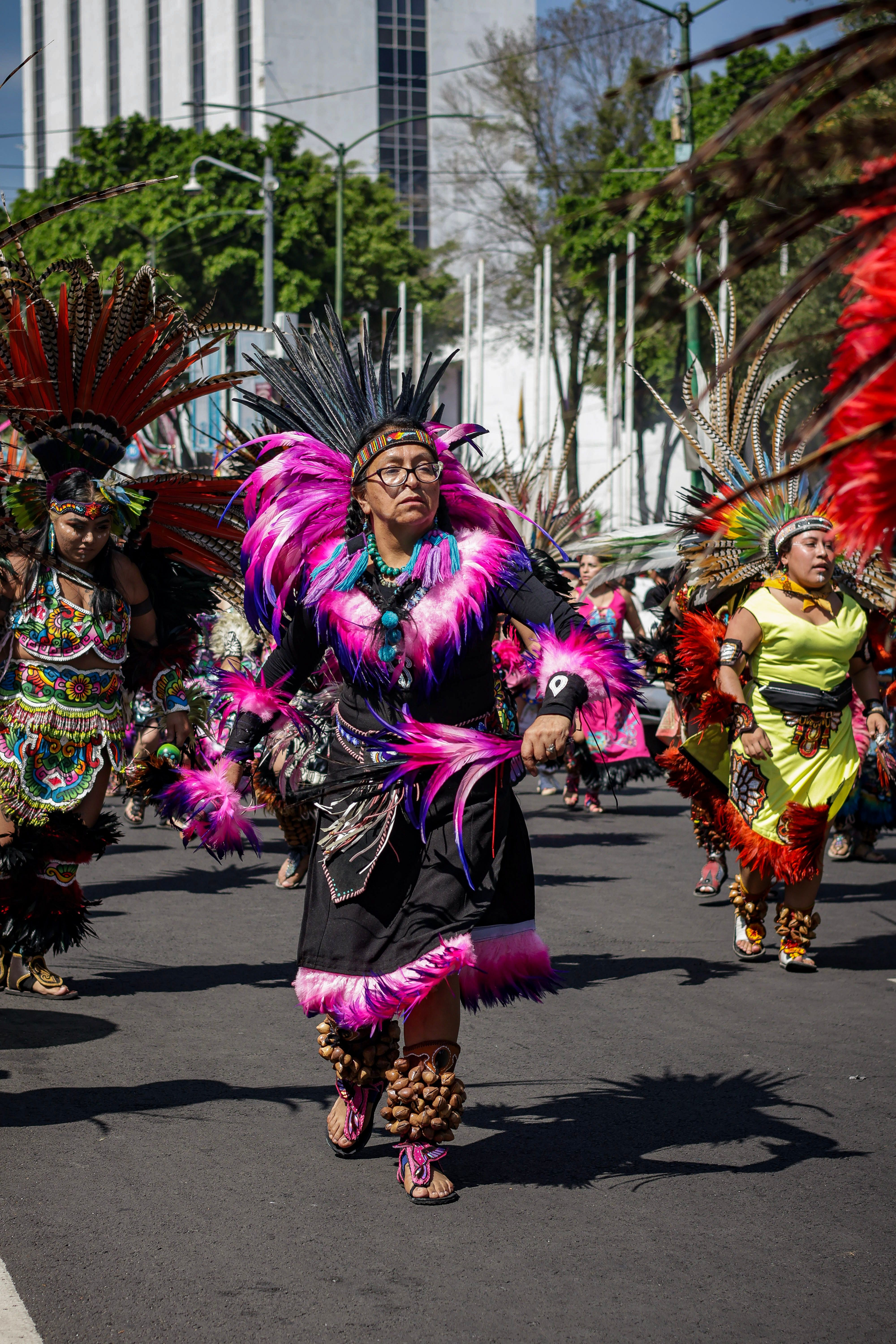 Colorful Aztec Dancers in Traditional Parade · Free Stock Photo