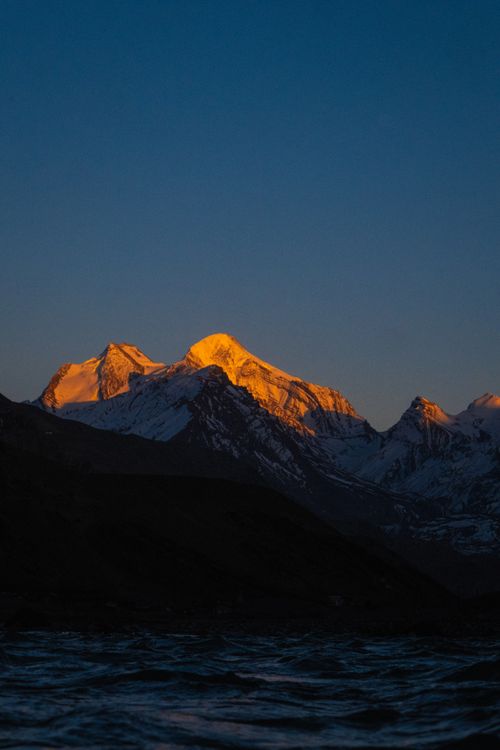 Free Stunning view of sunlit snow-capped mountains in Himachal Pradesh, India during sunrise. Stock Photo