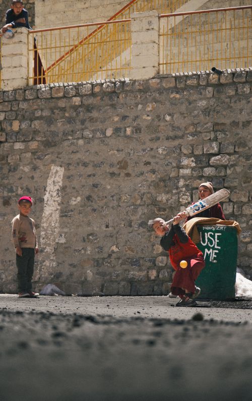 Free Children enjoy a cricket game in the outdoor setting of Key Village, Himachal Pradesh. Stock Photo
