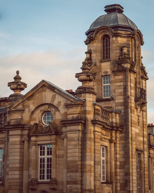 Free Beautiful historic building facade with intricate design captured at sunset. Stock Photo