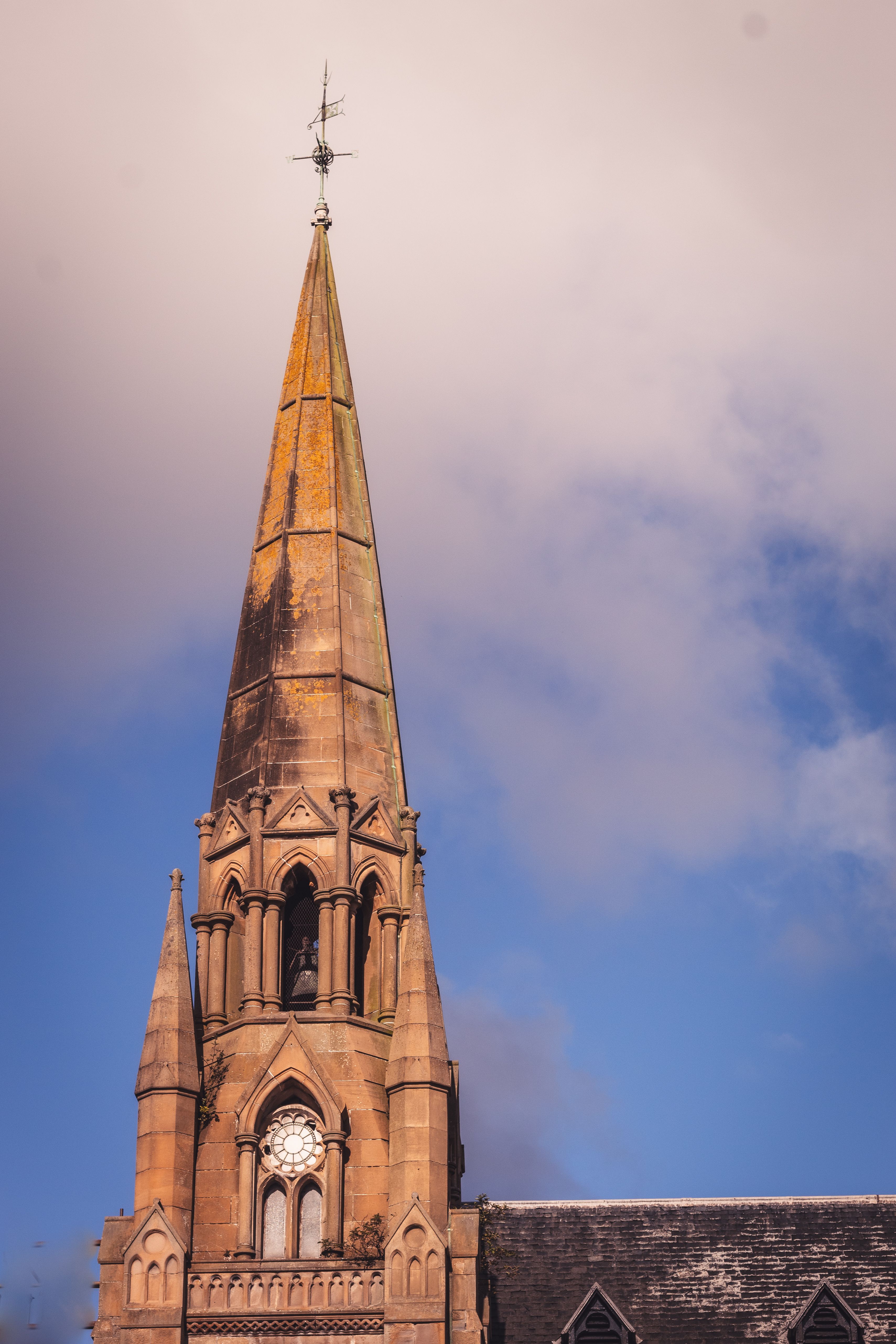 Gothic Church Spire Against a Blue Sky · Free Stock Photo
