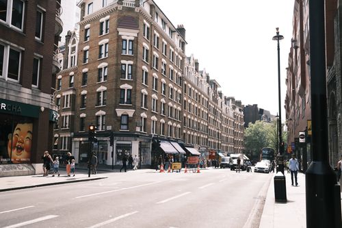 Free Vibrant street view in central London with classic architecture and bustling activity. Stock Photo