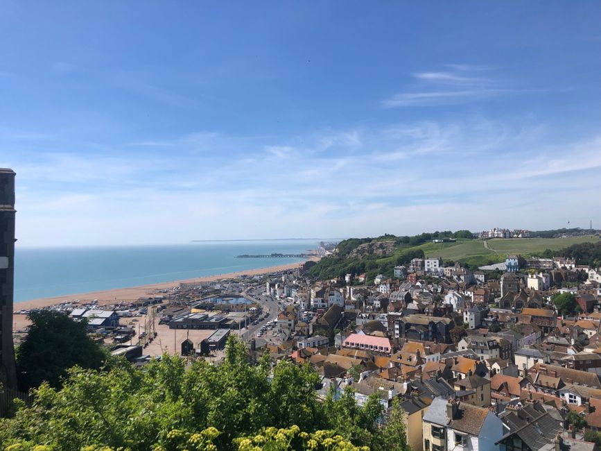 Sunny aerial view over Hastings with coastline and historical buildings in the UK.