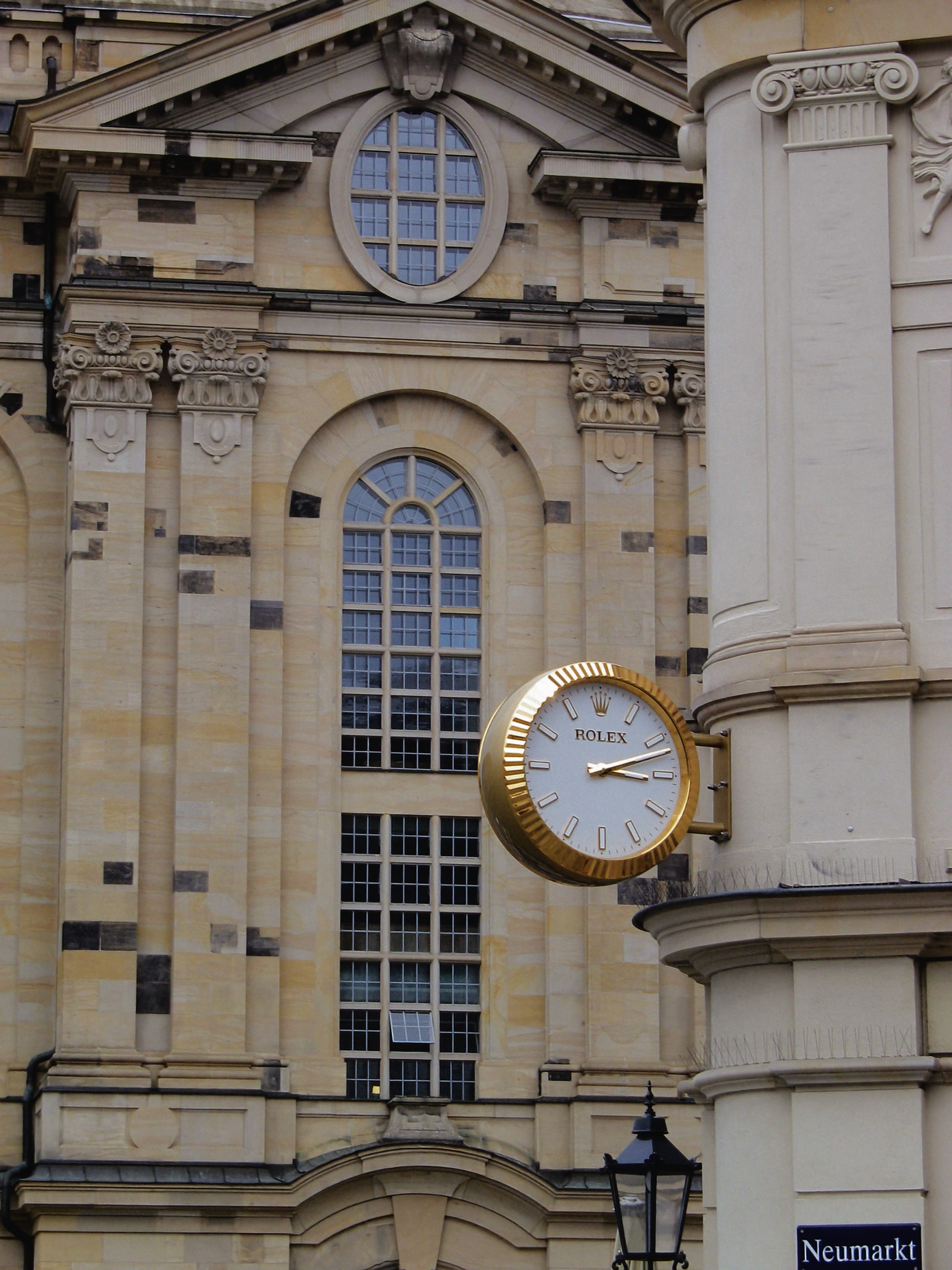 Historic European Architecture with Rolex Clock · Free Stock Photo