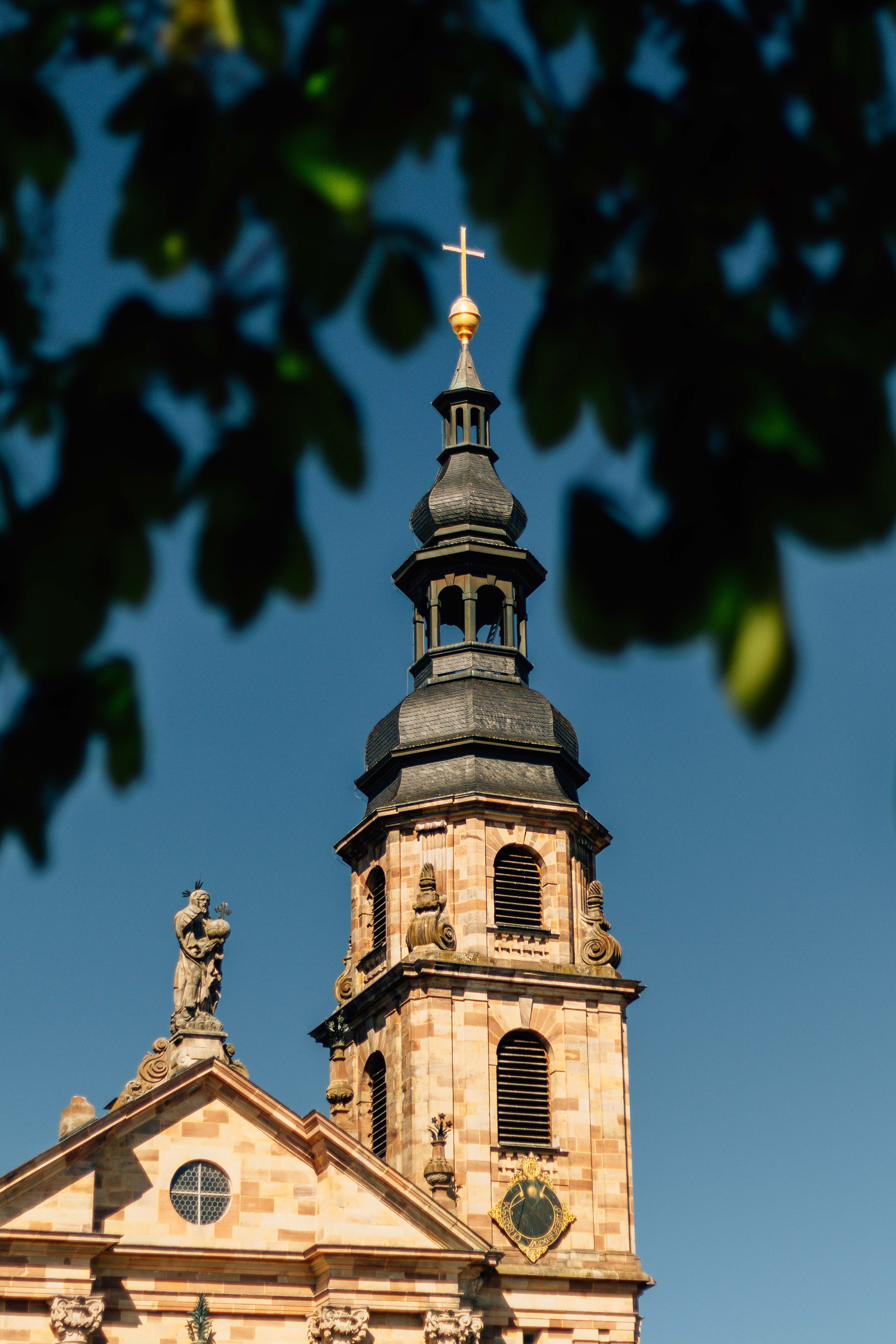 Historic Church Tower with Golden Cross · Free Stock Photo