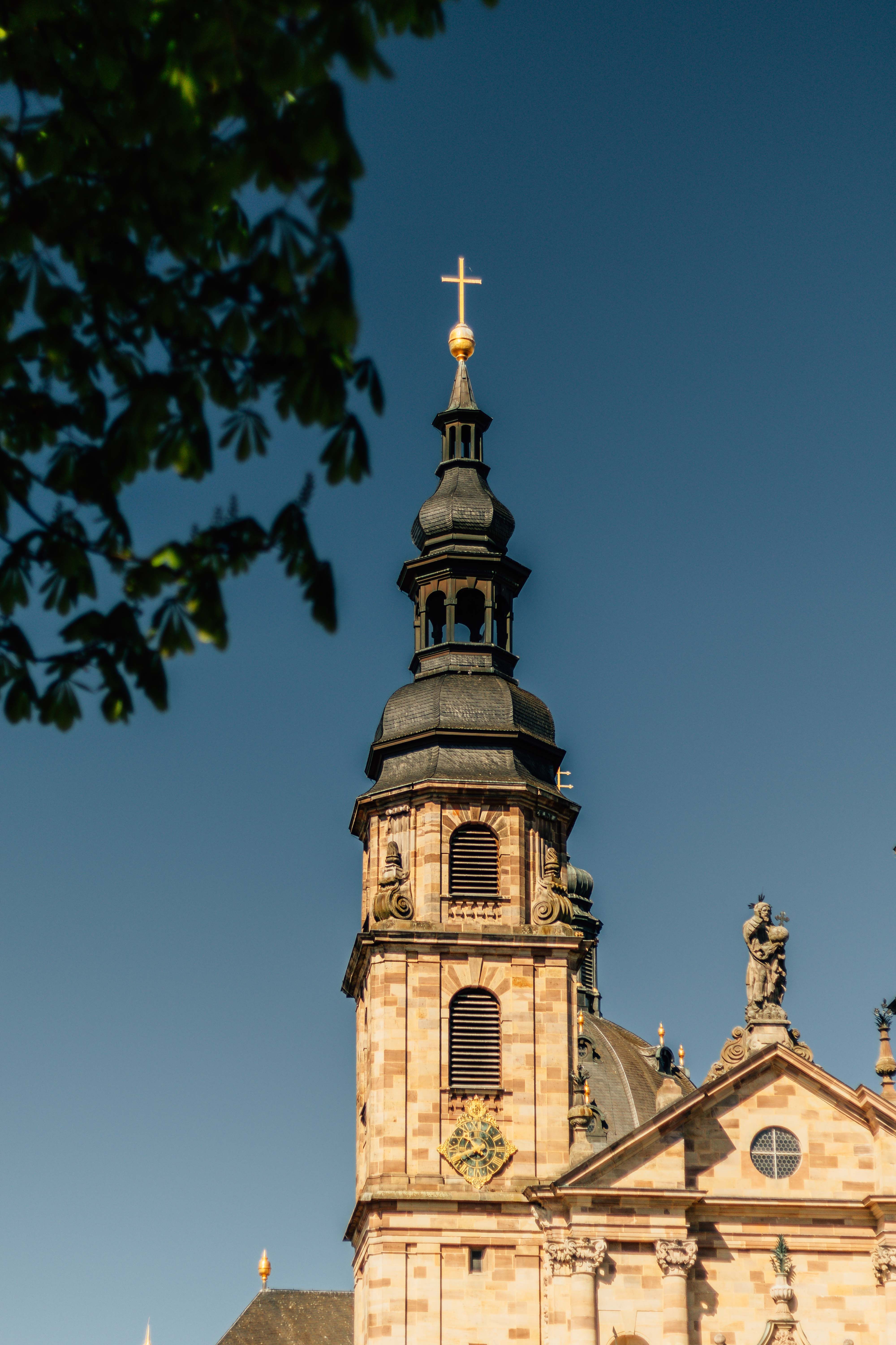 Historic Church Tower under Clear Blue Sky · Free Stock Photo